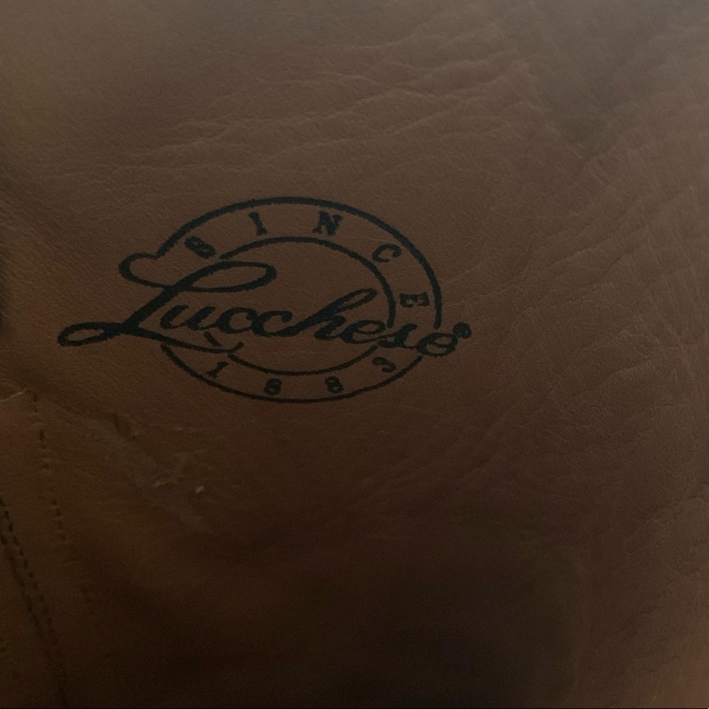 Black lace Lucchese boots.